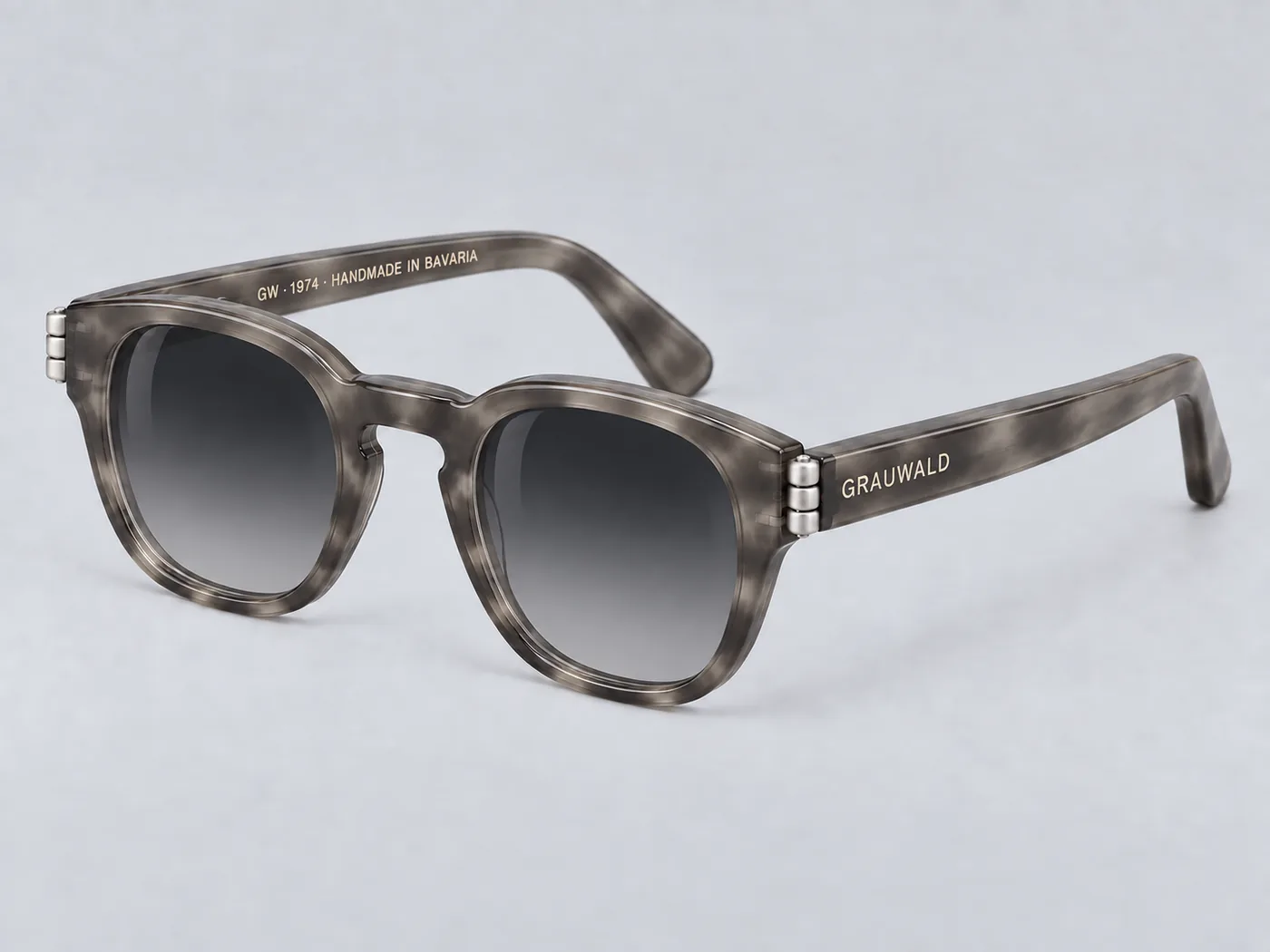 CN-05 in Grauwald Smoke — grey marbled acetate, three-quarter view